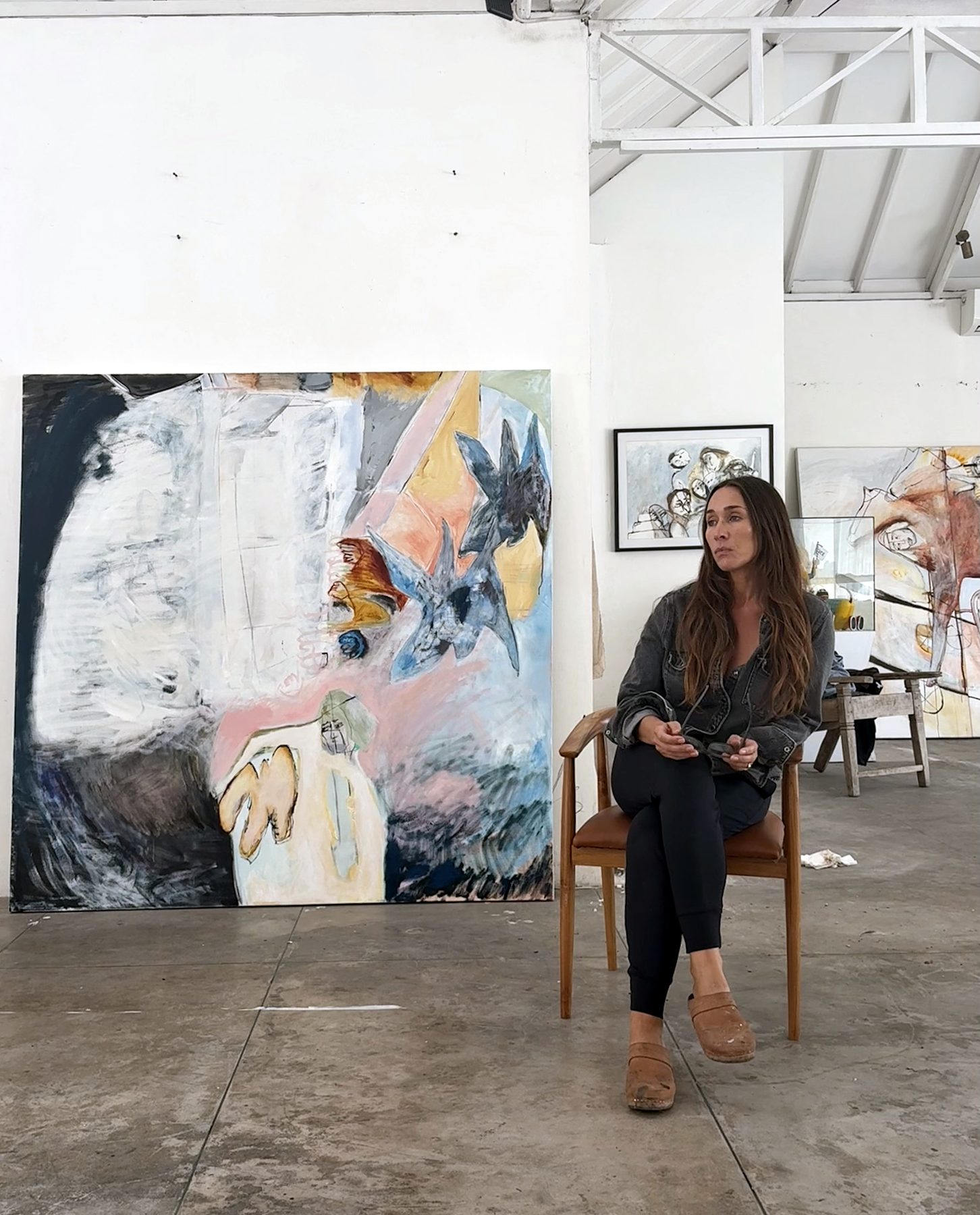 Lydia Janssen seated beside Study in Release (I) in the studio